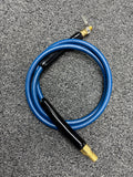 Blue hose with black nozzle on a gray surface