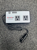 DrimMek car power inverter with two sockets and a car charger on a textured surface